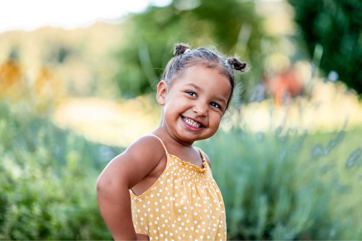 Young girl with pony tails smiling